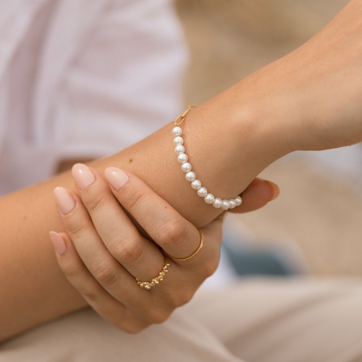 Link armbånd med perler i 18 karat forgyldt titanium