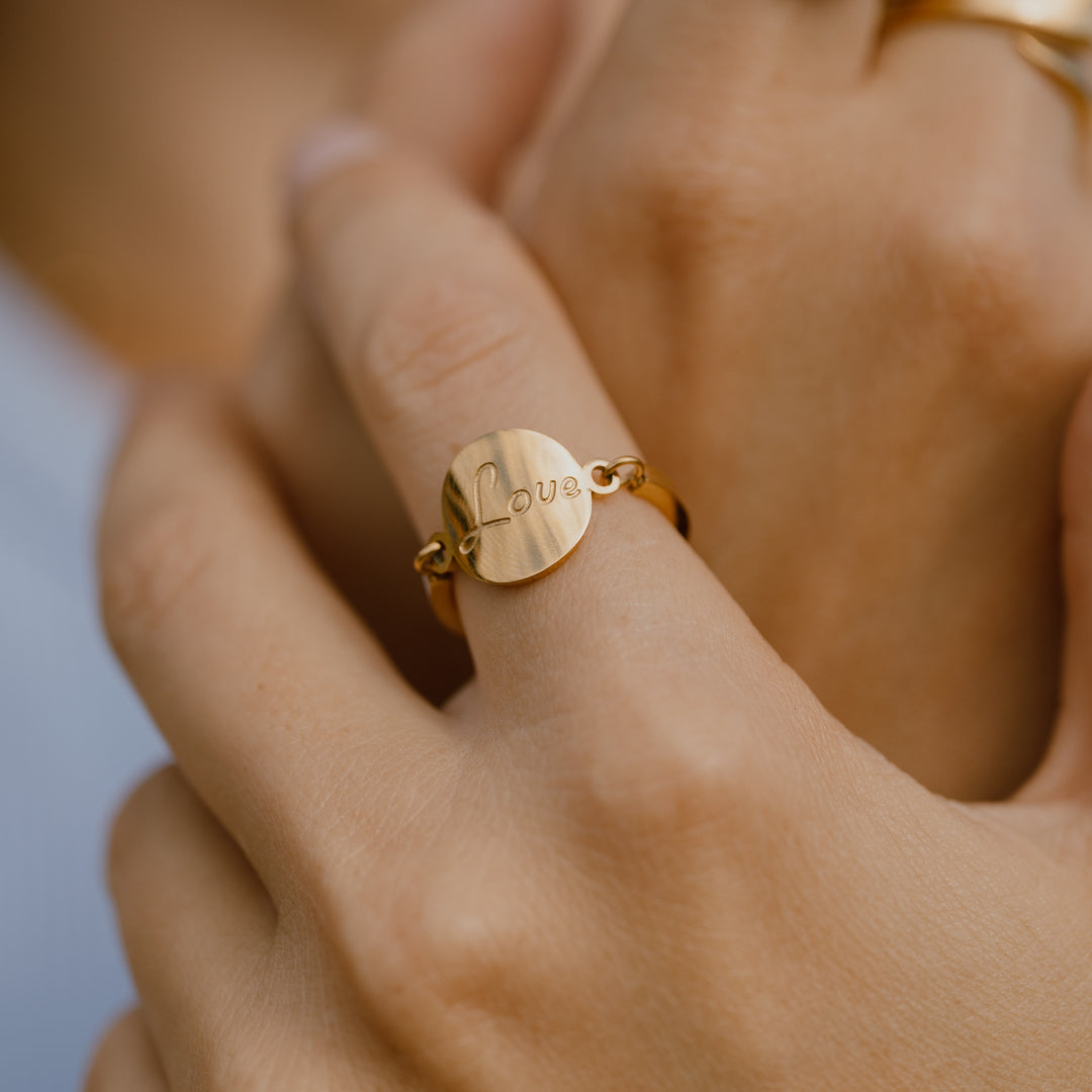 Love ring der kan vippe - 18 karat forgyldt ædelstål