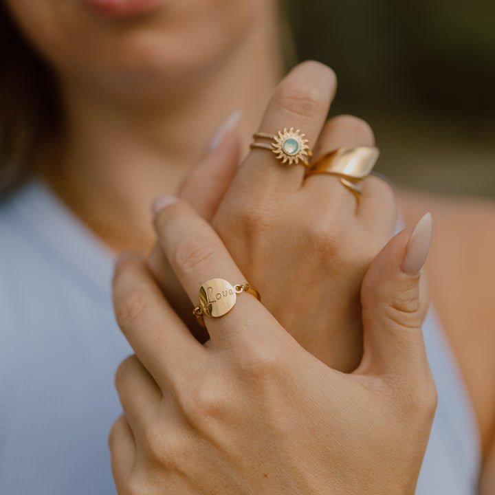 Love ring der kan vippe - 18 karat forgyldt ædelstål