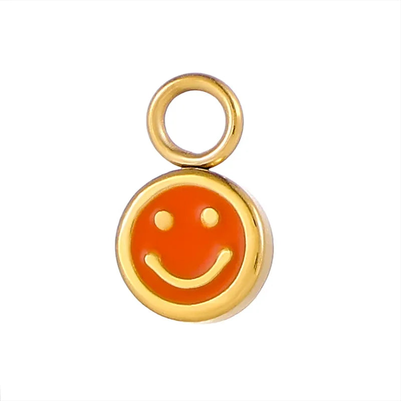 Smiley micro vedhæng i forgyldt titanium – orange og grøn