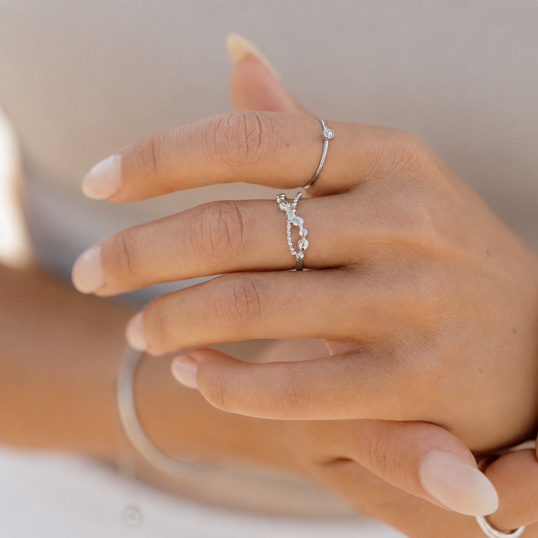 Boblet kryds ring - ædelstål