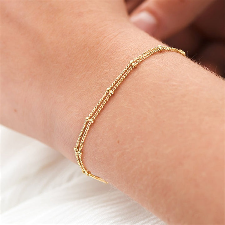 Armbånd i lag med små kugler 14 kt. forgyldt rustfrit stål